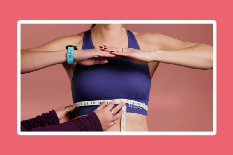 A measuring tape wrapped snugly around the ribcage, directly under the bust